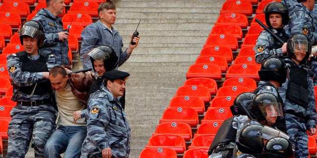 Riot police practice to ward off hooligans at the Luzhniki stadium in Moscow, May 16, 2008.
