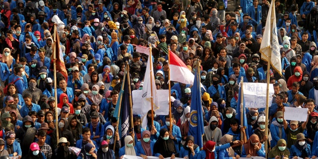 University students march to a local parliament building during a protest in Makassar, South Sulawesi province, Indonesia, on Sept. 27, 2019.