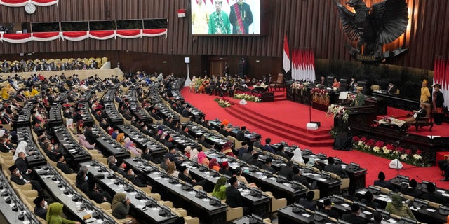 Indonesian President Joko Widodo, wearing traditional attire from the Bangka Belitung Islands, delivers his State of the Nation Address ahead of the country's Independence Day at the parliament building in Jakarta, Indonesia, August 16, 2022. 