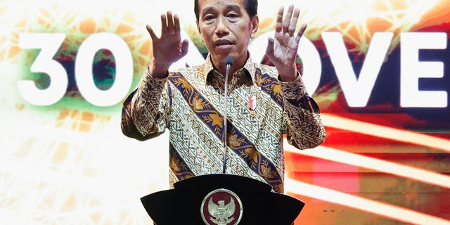 Indonesian President Joko Widodo gestures as he delivers his remarks during the annual meeting of Indonesia's central bank with its financial stakeholders in Jakarta, Indonesia, November 30, 2022. 