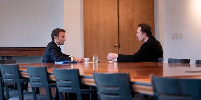 France's President Emmanuel Macron and Elon Musk meet in New Orleans in this undated picture obtained from social media and released Dec. 2, 2022. 