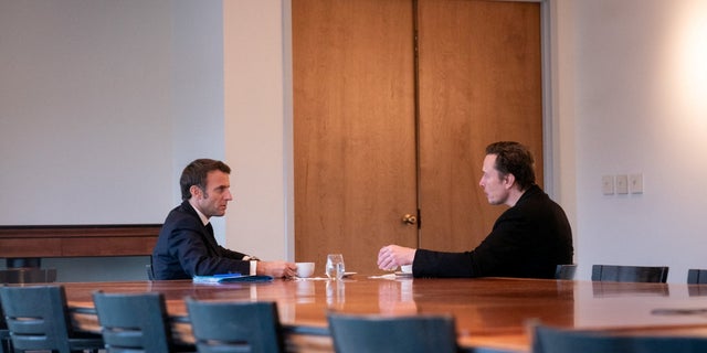 France's President Emmanuel Macron and Elon Musk meet in New Orleans in this undated picture obtained from social media and released Dec. 2, 2022. 