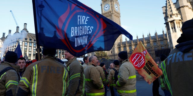 Members of the Fire Brigades Union take part in a rally regarding possible future strike action linked to a pay dispute, in London Dec. 6, 2022.  