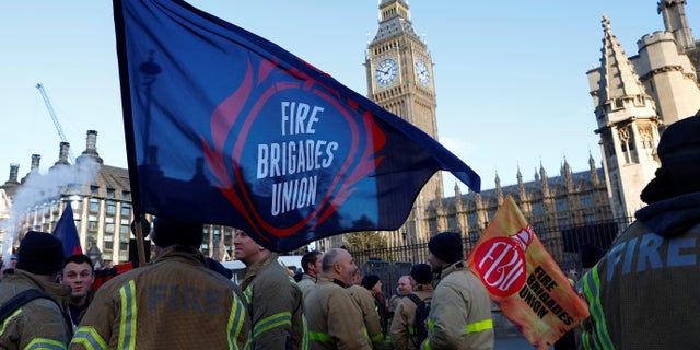 Members of the Fire Brigades Union take part in a rally regarding possible future strike action linked to a pay dispute, in London Dec. 6, 2022.