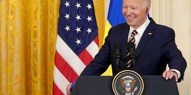 U.S. President Joe Biden reacts during a joint news conference with Ukraine's President Volodymyr Zelenskiy (not pictured) in the East Room of the White House in Washington, U.S., December 21, 2022. REUTERS/Kevin Lamarque