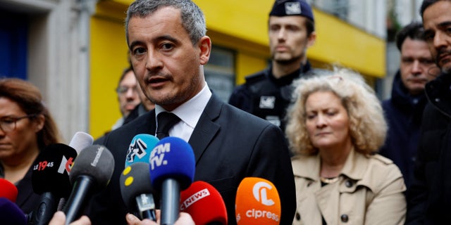 French Interior Minister Gerald Darmanin talks to journalists during a visit to Rue d'Enghien after gunshots were fired, killing and injuring several people in a central district of Paris on Friday.  