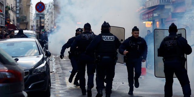 Clashes with French police during a demonstration near the Rue d'Enghien took place after gunshots were fired earlier Friday, killing and injuring several people in a central district of Paris.