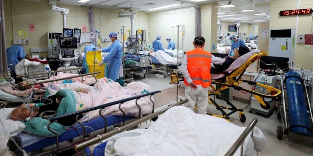 Medical workers attend to patients at the intensive care unit of the emergency department at Beijing Chaoyang hospital, amid the COVID-19 outbreak in Beijing Dec. 27, 2022.