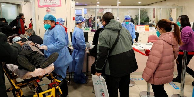 Patients line up for treatment at the emergency department of Beijing Chaoyang hospital, amid the COVID-19 outbreak in Beijing Dec. 27, 2022.