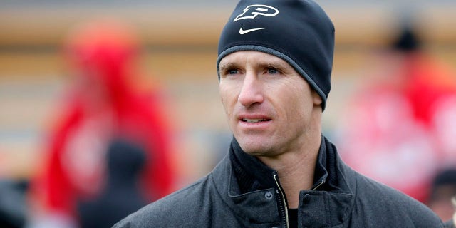 Former Boilermaker and current New Orleans Saints quarterback Drew Brees looks on during an NCAA football game between the Wisconsin Badgers and Purdue Boilermakers at Ross-Ade Stadium on November 19, 2016 in West Lafayette, IN. The Wisconsin Badgers defeated the Purdue Boilermakers 49–20.