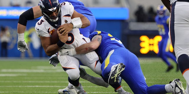 Russell Wilson, #3 of the Denver Broncos, is sacked during the second half of the game against the Los Angeles Rams at SoFi Stadium on Dec. 25, 2022 in Inglewood, California.