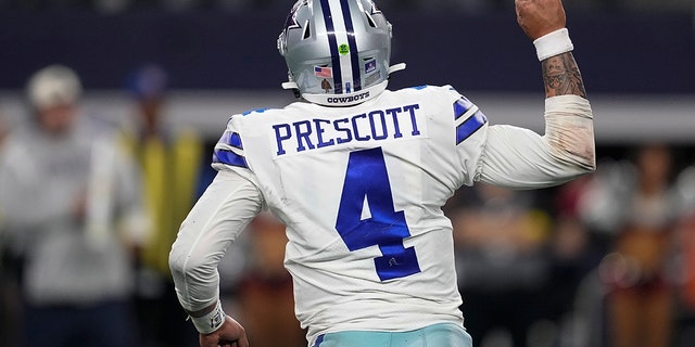 Dallas Cowboys' Dak Prescott celebrates a touchdown during the second half of an NFL football game against the Philadelphia Eagles Saturday, Dec. 24, 2022, in Arlington, Texas. 