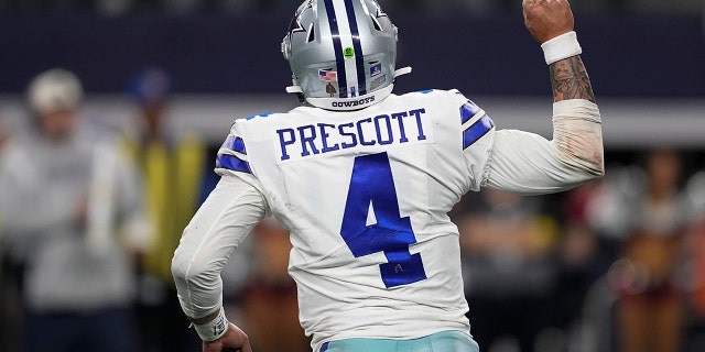 Dallas Cowboys' Dak Prescott celebrates a touchdown during the second half of an NFL football game against the Philadelphia Eagles on Saturday, December 24, 2022 in Arlington, Texas. 