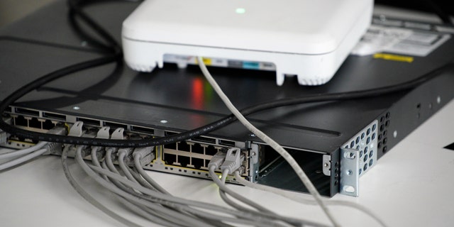 Routers with network cables are seen during the Hackyeah hackathon in Warsaw, Poland on September 18, 2019. The Hackyeah hackathon is the largest stationary hackathon in Europe with around 2500 participants taking part in an overnight hacking compeition and over 100 thousand Euros in prize money.