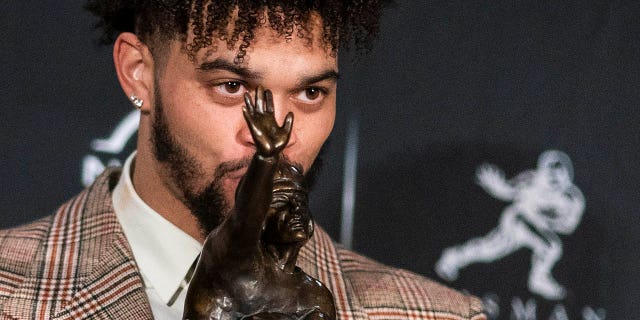 Southern California quarterback Caleb Williams poses for a photograph after winning the Heisman Trophy, Saturday, Dec. 10, 2022, in New York.