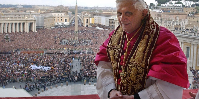 VATICAN CITY, Vatican:  Pope Benedict XVI, Cardinal Joseph Ratzinger of Germany, appears on the balcony of St Peter's Basilica in the Vatican after being elected by the conclave of cardinals, 19 April 2005.  AFP PHOTO POOL Osservatore Romano Arturo Mari  (Photo credit should read ARTURO MARI/AFP via Getty Images)