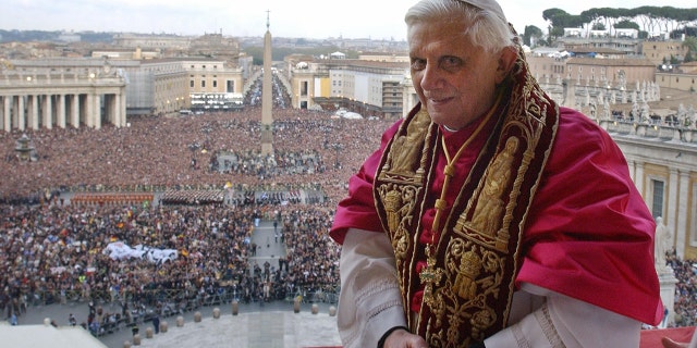 VATICAN CITY, Vatican:  Pope Benedict XVI, Cardinal Joseph Ratzinger of Germany, appears on the balcony of St Peter's Basilica in the Vatican after being elected by the conclave of cardinals, 19 April 2005.  AFP PHOTO POOL Osservatore Romano Arturo Mari  (Photo credit should read ARTURO MARI/AFP via Getty Images)