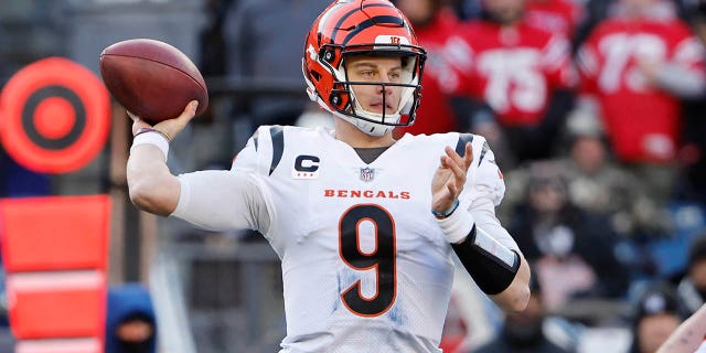 Joe Burrow of the Cincinnati Bengals attempts a pass during the second quarter against the New England Patriots at Gillette Stadium on December 24, 2022 in Foxborough, Massachusetts. 