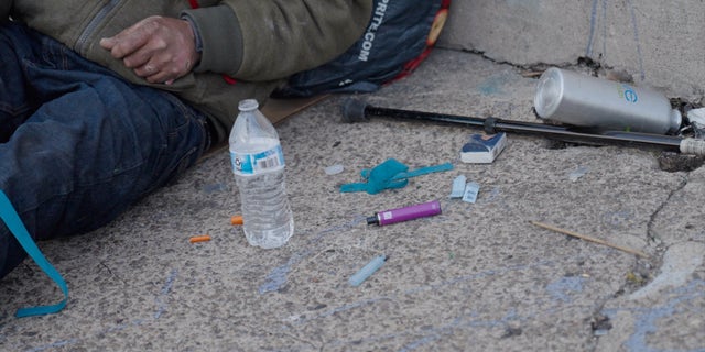 A vape and rubber ties lie next to the addict Rodriguez woke up. The cap to a needle can also be seen. All are common sights in Kensington.