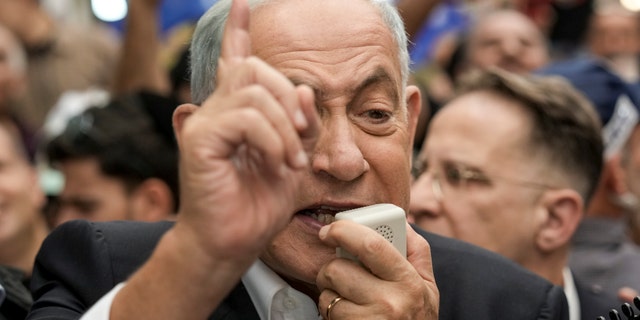 Likud party head and incoming Israeli Prime Minister Benjamin Netanyahu speaks to his supporters as he visits Hatikva Market in Tel Aviv, Israel, Friday, Oct. 28, 2022.