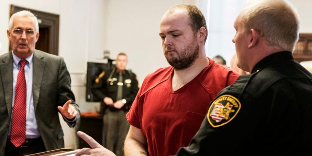 George Wagner IV, center, is escorted out of the courtroom after his arraignment on Nov. 28, 2018, at the Pike County Courthouse, in Waverly, Ohio.