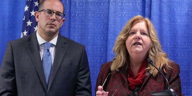 Nassau County District Attorney Anne Donnelly, right, has opened an investigation into congressman-elect George Santos after he admitted to fabricating his resume during his campaign. 