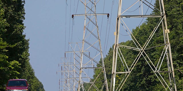 This file image shows power transmission lines deliver electricity to rural Orange County on Aug. 14, 2018, near Hillsborough, N.C. 