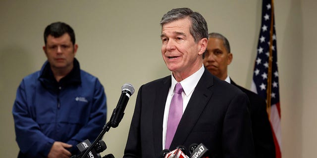 Gov. Roy Cooper speaks at a news conference on Monday, Dec. 5, 2022, at the Moore County Sheriffs office in Carthage, N.C., regarding an attack on critical infrastructure that has caused a power outage to many around Moore County.