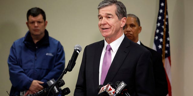 Gov. Roy Cooper speaks at a news conference on Monday, Dec. 5, 2022, at the Moore County Sheriffs office in Carthage, N.C., regarding an attack on critical infrastructure that has caused a power outage to many around Moore County.