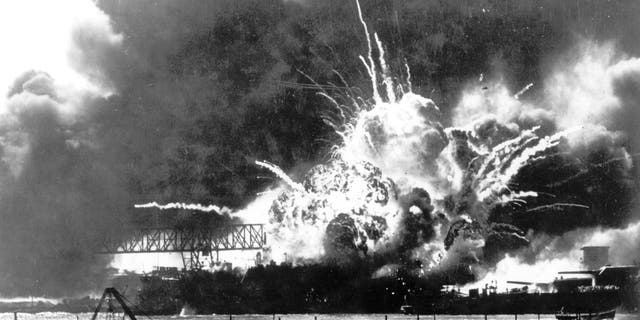 FILE - In this photo released by the U.S. Navy, the destroyer USS Shaw explodes after being hit by bombs during the Japanese surprise attack on Pearl Harbor, Hawaii, December 7, 1941. A few centenarian survivors of the attack on Pearl Harbor are expected to gather at the scene of the Japanese bombing on Wednesday, Dec. 7, 2022, to remember those who perished 81 years ago.