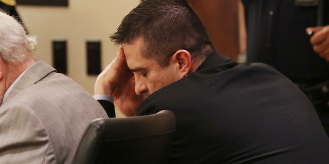 Former U.S. Border Patrol supervisor Juan David Ortiz reacts as recorded jail phone calls to his wife, Daniella, are played outside the presence of the jury during his capital murder trial at the Cadena-Reeves Justice Center in San Antonio, Texas, Tuesday, Dec. 6, 2022.