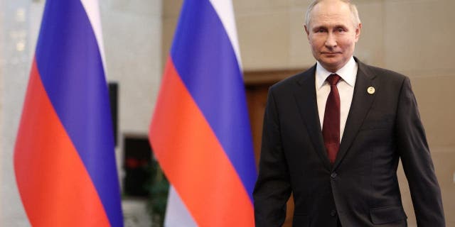 Russian President Vladimir Putin arrives at his news conference after the Intergovernmental Council of the Eurasian Economic Union summit in Bishkek, Kyrgyzstan on Friday.