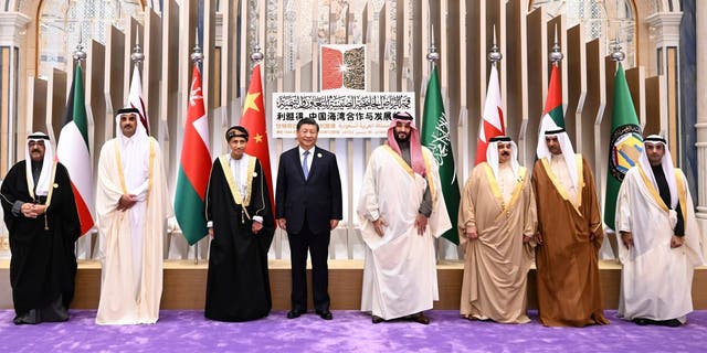 In this photo released by Xinhua News Agency, Saudi Crown Prince and Prime Minister Mohammed bin Salman, center right, poses for photos with Chinese President Xi Jinping, center left, and other Arab Gulf leaders including Qatari Emir Sheikh Tamim bin Hamad Al Thani, King of Bahrain Hamad bin Isa Al Khalifa, Crown Prince of Kuwait Sheikh Mishal Al-Ahmad Al-Jaber Al-Sabah, Omani Deputy Prime Minister for the Council of Ministers Sayyid Fahd bin Mahmoud Al Said, Ruler of Fujairah of United Arab Emirates (UAE) Sheikh Hamad bin Mohammed Al Sharqi, and Gulf Cooperation Council (GCC) Secretary General Dr. Nayef Falah Al-Hajraf during the China-Gulf Cooperation Council (GCC) Summit, in Riyadh, Saudi Arabia, Friday, Dec. 9, 2022. (Xie Huanchi/Xinhua via AP)