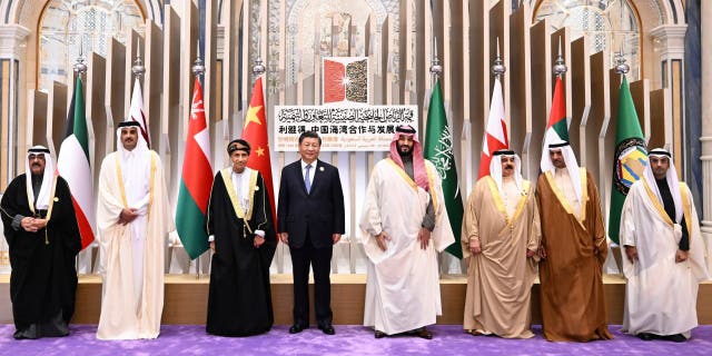 In this photo released by Xinhua News Agency, Saudi Crown Prince and Prime Minister Mohammed bin Salman, center right, poses for photos with Chinese President Xi Jinping, center left, and other Arab Gulf leaders including Qatari Emir Sheikh Tamim bin Hamad Al Thani, King of Bahrain Hamad bin Isa Al Khalifa, Crown Prince of Kuwait Sheikh Mishal Al-Ahmad Al-Jaber Al-Sabah, Omani Deputy Prime Minister for the Council of Ministers Sayyid Fahd bin Mahmoud Al Said, Ruler of Fujairah of United Arab Emirates (UAE) Sheikh Hamad bin Mohammed Al Sharqi, and Gulf Cooperation Council (GCC) Secretary General Dr. Nayef Falah Al-Hajraf during the China-Gulf Cooperation Council (GCC) Summit, in Riyadh, Saudi Arabia, Friday, Dec. 9, 2022. (Xie Huanchi/Xinhua via AP)