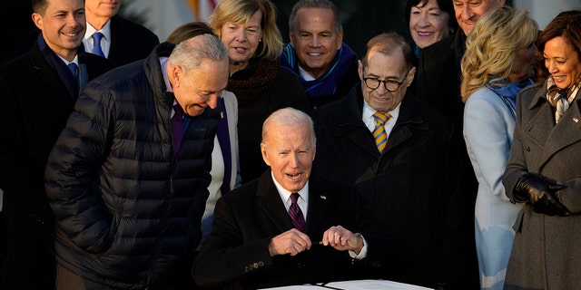 President Joe Biden signs the Respect for Marriage Act on Dec. 13, 2022, at the White House.