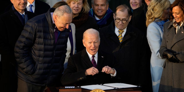 President Joe Biden signs the Respect for Marriage Act on Dec. 13, 2022, at the White House.