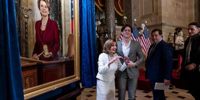 Speaker of the House Nancy Pelosi, D-Calif., is joined by her family as they attend her portrait unveiling ceremony in Statuary Hall at the Capitol in Washington, Wednesday, Dec. 14, 2022. 