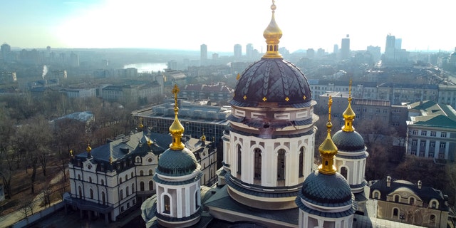 A hole from a shell explosion in the damaged dome of an Orthodox church is seen after what Russian officials in Donetsk said was a shelling by Ukrainian forces, in Donetsk, the capital of Russian-controlled Donetsk region, eastern Ukraine, Thursday, Dec. 15, 2022.