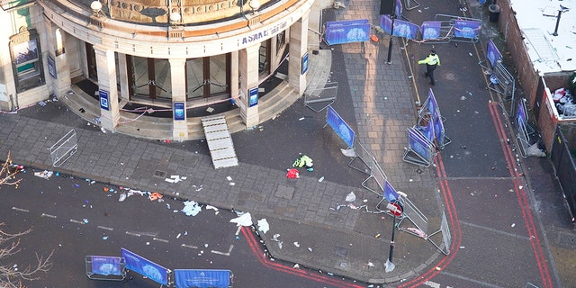 The scene outside Brixton O2 Academy where police are investigating the circumstances which led to four people sustaining critical injuries in an apparent crush as a large crowd tried to force their way into the south London concert venue, Friday Dec. 16, 2022.