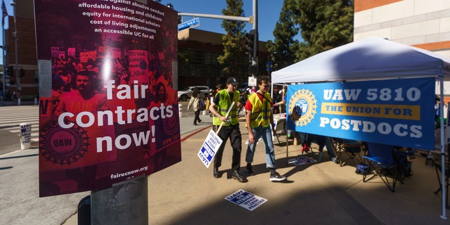Academic workers participate in a protest outside the UCLA campus in Los Angeles, Monday, Nov. 14, 2022. 