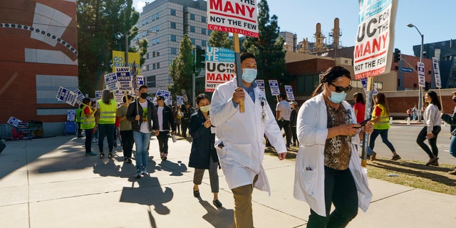 A group of people participate in a protest outside the UCLA campus in Los Angeles, Monday, Nov. 14, 2022. 