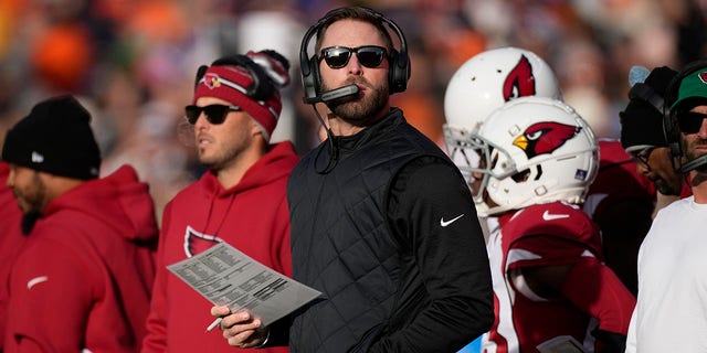 Arizona Cardinals head coach Kliff Kingsbury looks toward the scoreboard during the first half of a game against the Denver Broncos Dec. 18, 2022, in Denver, Colo.