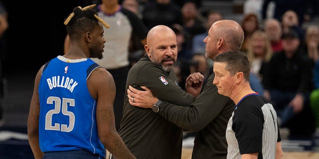 Dallas Mavericks head coach Jason Kidd, second from left, reacts after being ejected during the second half of an NBA basketball game against the Minnesota Timberwolves, Monday, Dec. 19, 2022, in Minneapolis. 