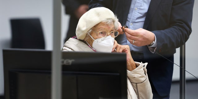 Irmgard Furchner, accused of being part of the apparatus that helped the Nazis' Stutthof concentration camp function, appears in court for the verdict in her trial in Itzehoe, Germay, Tuesday, Dec. 20, 2022. (Christian Charisius/Pool Photo via DPA)