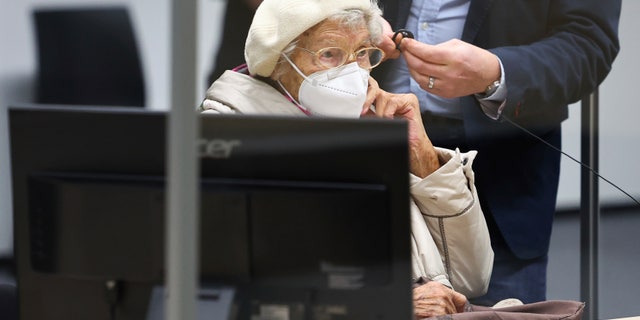 Irmgard Furchner, accused of being part of the apparatus that helped the Nazis' Stutthof concentration camp function, appears in court for the verdict in her trial in Itzehoe, Germay, Tuesday, Dec. 20, 2022. (Christian Charisius/Pool Photo via DPA)