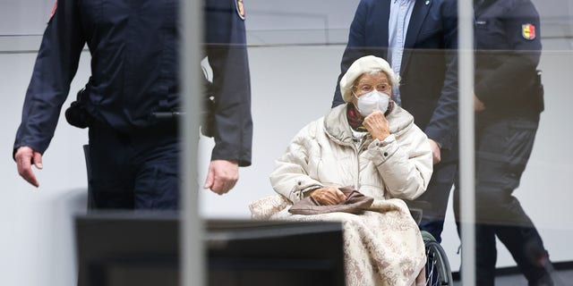 Irmgard Furchner, accused of being part of the apparatus that helped the Nazis' Stutthof concentration camp function, appears in court for the verdict in her trial in Itzehoe, Germay, Tuesday, Dec. 20, 2022. (Christian Charisius/Pool Photo via DPA)