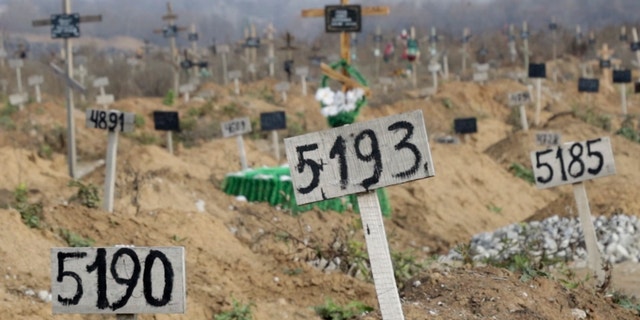 This November 16, 2022 photo from a video clip shows some of the new graves that have been dug since the start of the Russian blockade, in the Stary Karim cemetery on the outskirts of the occupied Ukrainian city of Mariupol. 