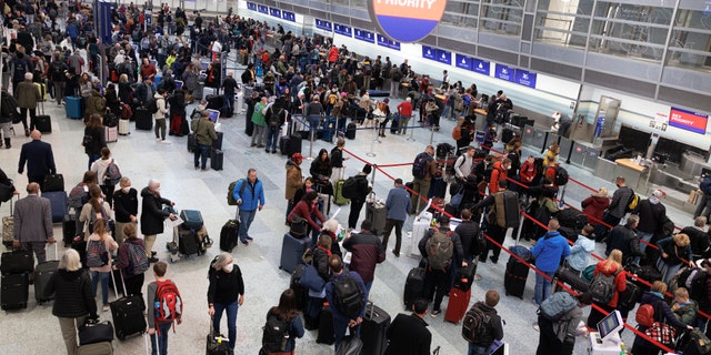 Travelers wait in line to check-in for their flights at Terminal 1 ahead of the Christmas Holiday at MSP Airport in Bloomington, Minn., on Thursday, Dec. 22, 2022.