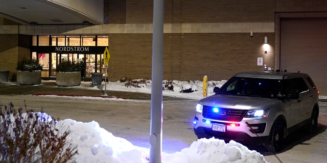 A police car sits parked outside Nordstrom at Mall of America after a shooting Friday, Dec. 23, 2022, in Bloomington, Minn. 