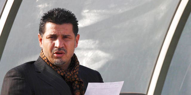 Former Iran's national soccer team coach Ali Daei before an Asian Cup 2011 qualifying soccer match between Iran and Singapore in Tehran, Iran, Jan, 14, 2009. Daei has expressed support for anti-government protests, saying that his wife and daughter were prevented from leaving the country on Monday, Dec. 26, 2022, after their plane made an unannounced stopover en route to Dubai. 